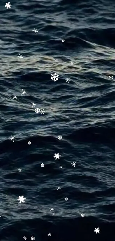 Snowflakes falling over dark ocean waves creating a calming winter wallpaper.