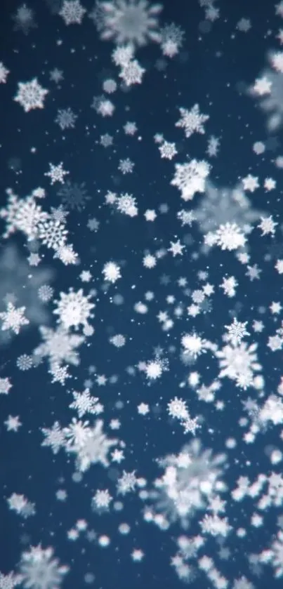 Snowflakes falling on a dark blue night sky
