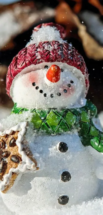 Festive snowman with gingerbread cookie in snowy winter setting.