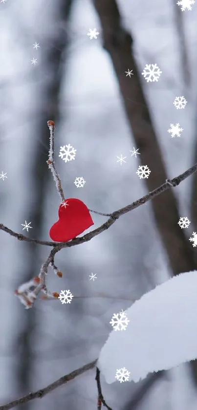 Snowy branch with red heart in winter forest wallpaper.