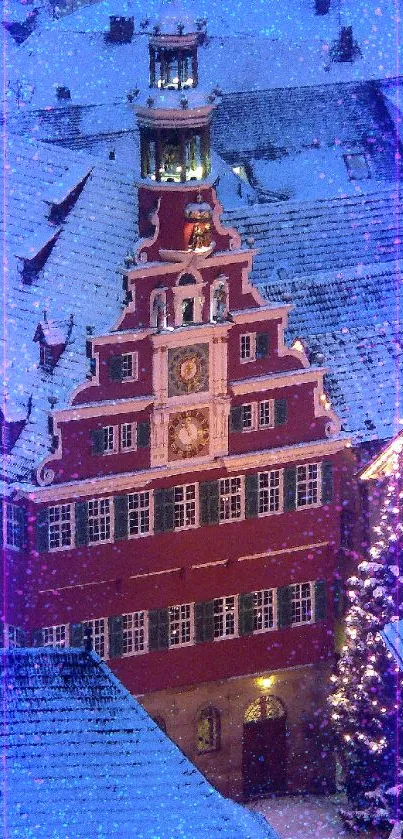 Snow-covered European town with festive lights and red building.