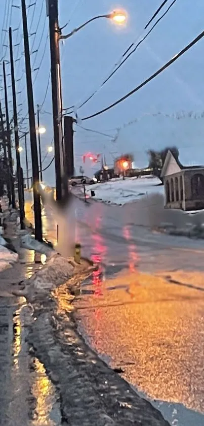 Snowy street with evening lights reflecting on icy roads.