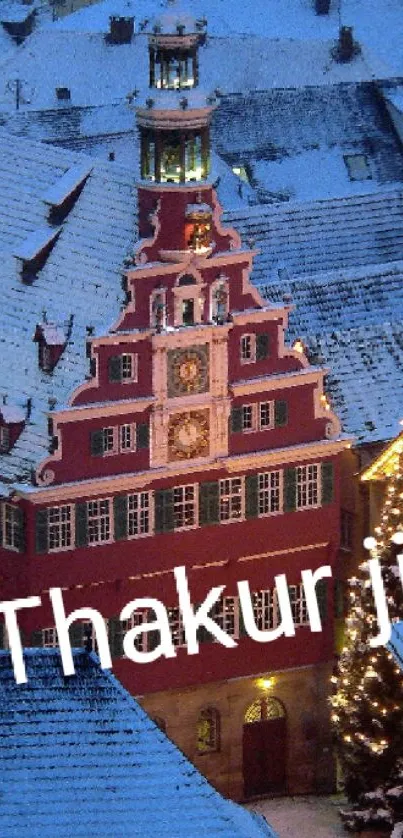 Snowy village with Christmas tree and cozy lights at dusk.