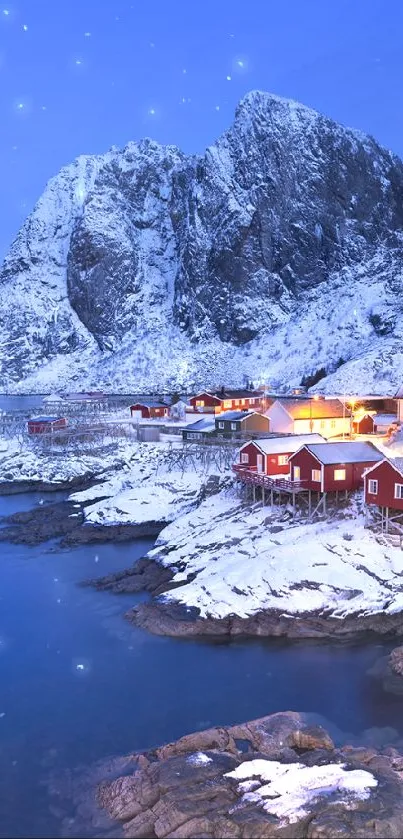 Snowy village by a fiord at dusk with blue skies and mountains.