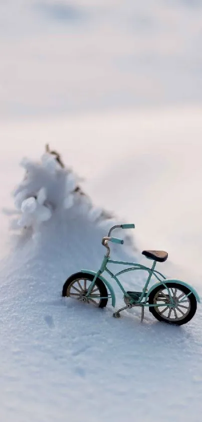 Miniature bicycle set on a serene, snowy landscape with light blue hues.