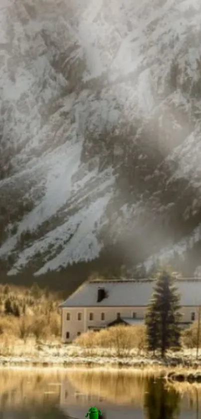 Snowy mountain landscape with cabin and lake.