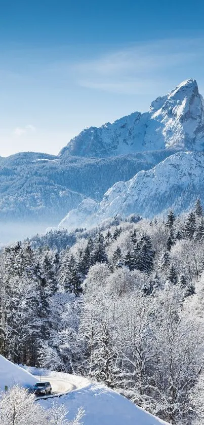 Snow-covered church with mountain backdrop, perfect as mobile wallpaper.