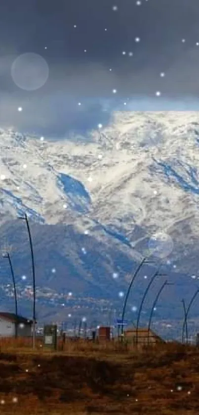 Snowy mountains under a cloudy sky, perfect for a serene mobile wallpaper.