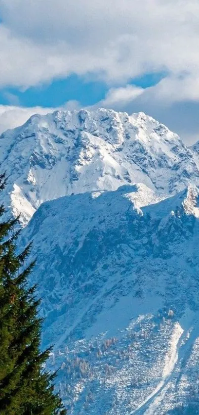 Snowy mountain landscape mobile wallpaper with blue sky.