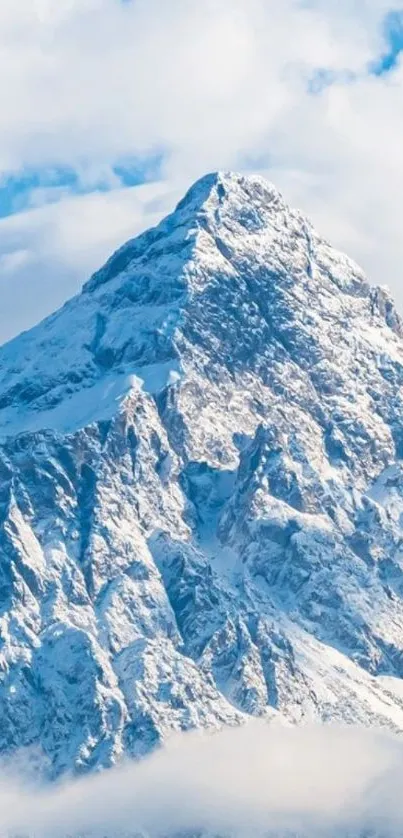 Snow-capped mountain peaks under a vibrant blue sky.