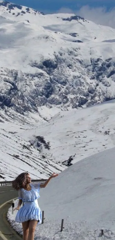 Woman on snowy mountain road, serene winter scene.