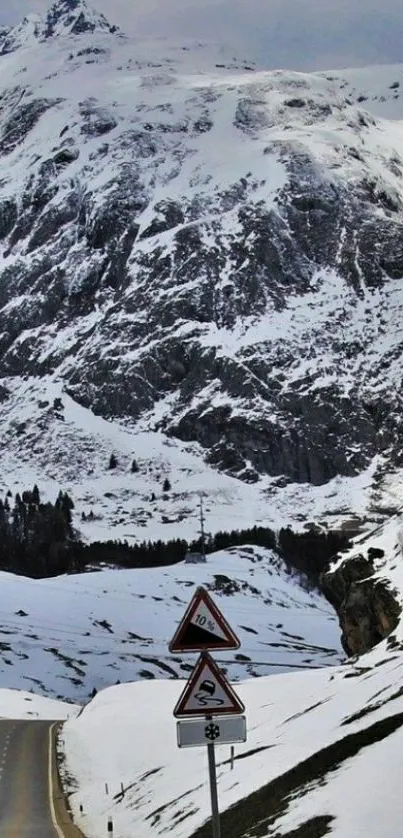 Beautiful snowy mountain road wallpaper with scenic views.