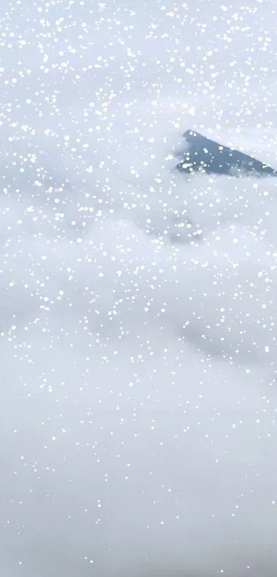 Mobile wallpaper of a snowy mountain peak with clouds and falling snowflakes.