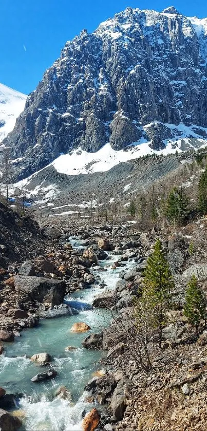 Snow-covered mountain with flowing stream.