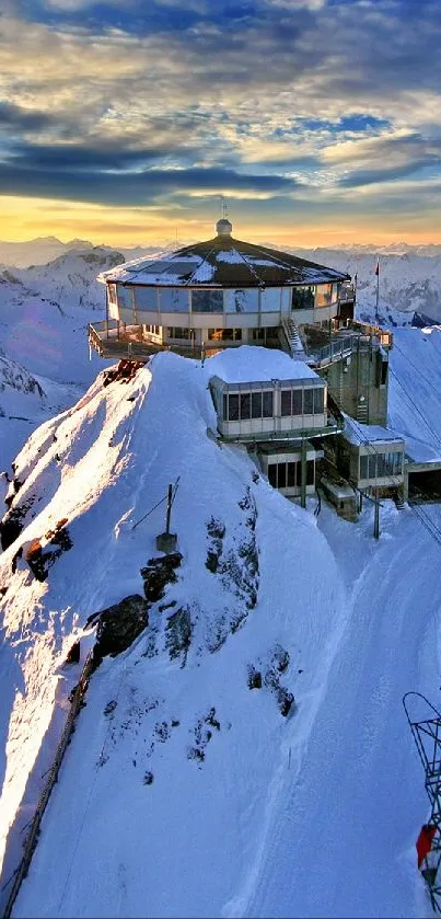 Breathtaking view of sunrise over snowy mountain peaks with a lone cabin.