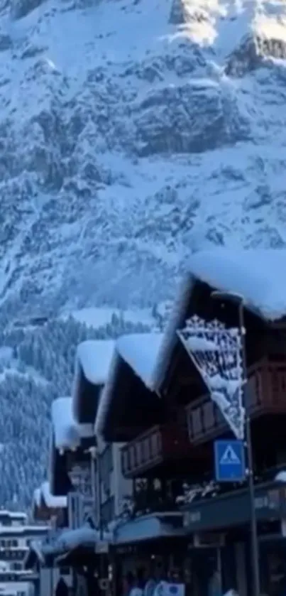 Snow-covered mountain village in serene winter landscape.