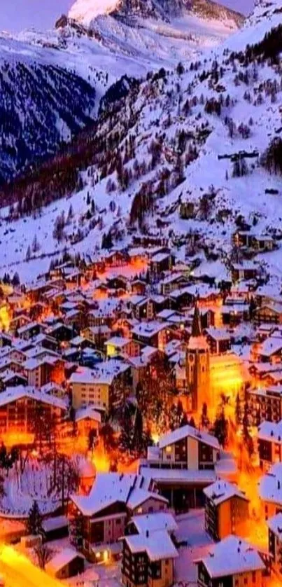 Snow-covered village in evening glow with mountain backdrop.