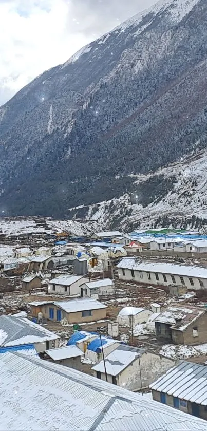 Snow-covered mountain village with rustic houses and scenic beauty.