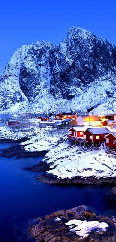 Snowy mountain village under blue sky.