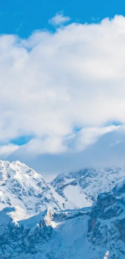 Snow-covered mountains under bright blue sky.