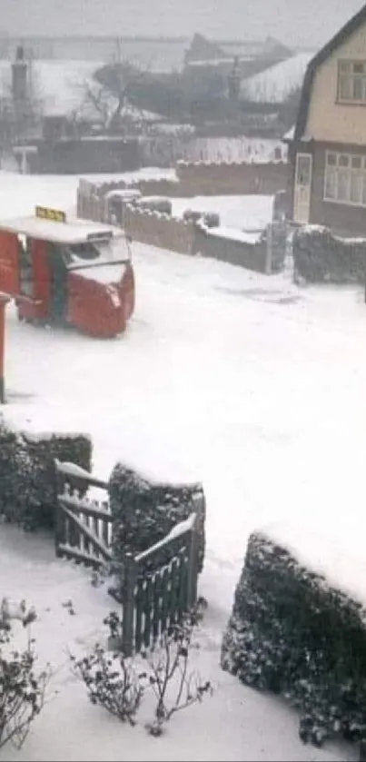 Snow-covered street with red phone booth.