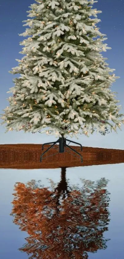 Snow-covered tree reflected on calm water under a brown night sky.