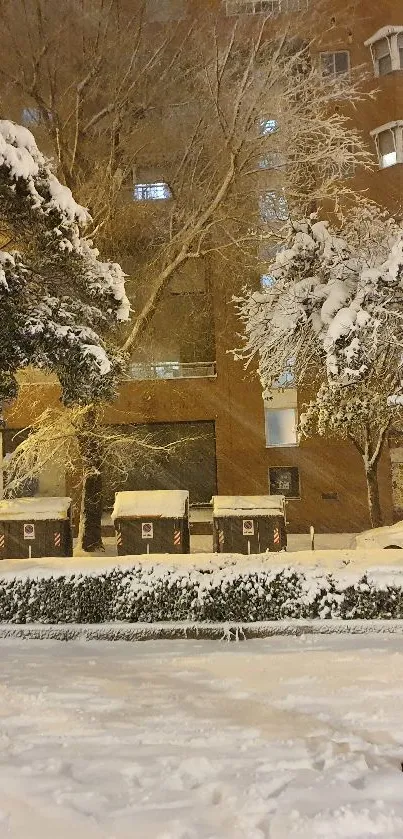 Snow-covered urban street scene at night.