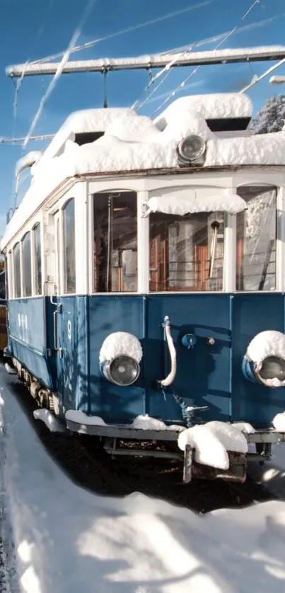 Vintage blue tram covered in snow on a winter day.