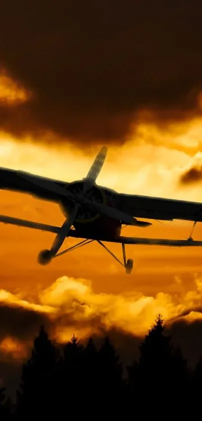 Plane flying at sunset with dramatic orange sky and dark silhouettes.