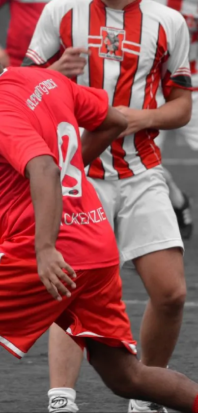 Soccer players in action on asphalt field.