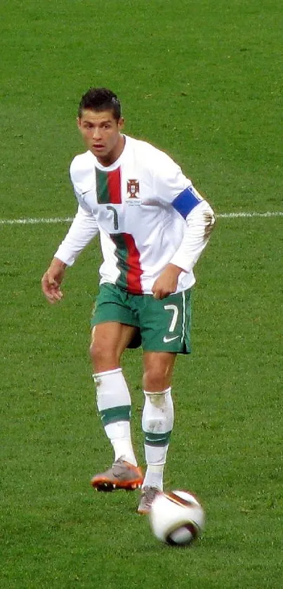 Football player in action on a lush green field during a soccer match.