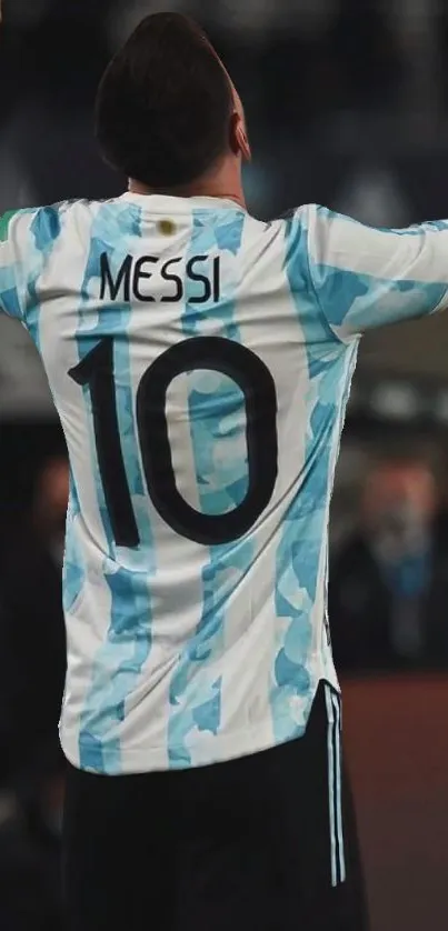 Soccer player celebrating goal, wearing number 10 jersey.