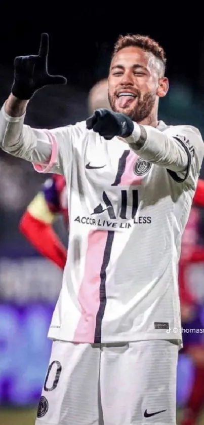 Soccer player in white jersey celebrating.