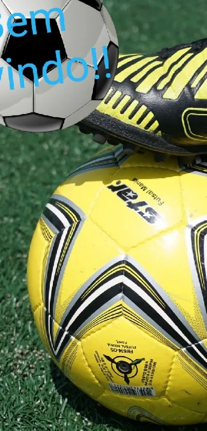 Yellow soccer ball with black shoe on green turf field.