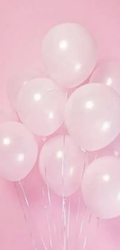 A soft pink wallpaper with floating balloons.