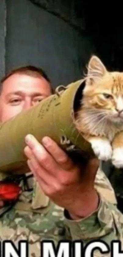 Soldier holding a cat in a tube with playful caption 'UN MICHIL'.