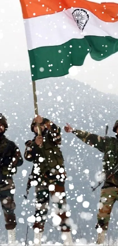 Soldiers stand in snow holding the Indian flag.