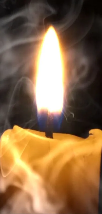 Close-up of a glowing candle flame with surrounding smoke.