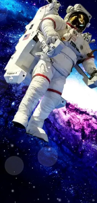 Astronaut floats in vibrant galaxy space wallpaper.