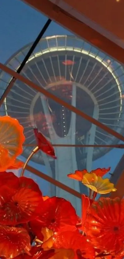 Space Needle with vibrant floral foreground under a clear blue sky.