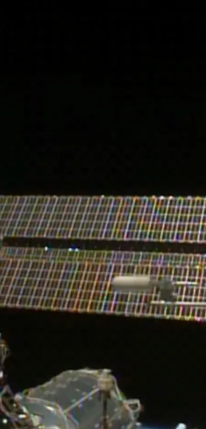 Space station with solar panels against a black sky.