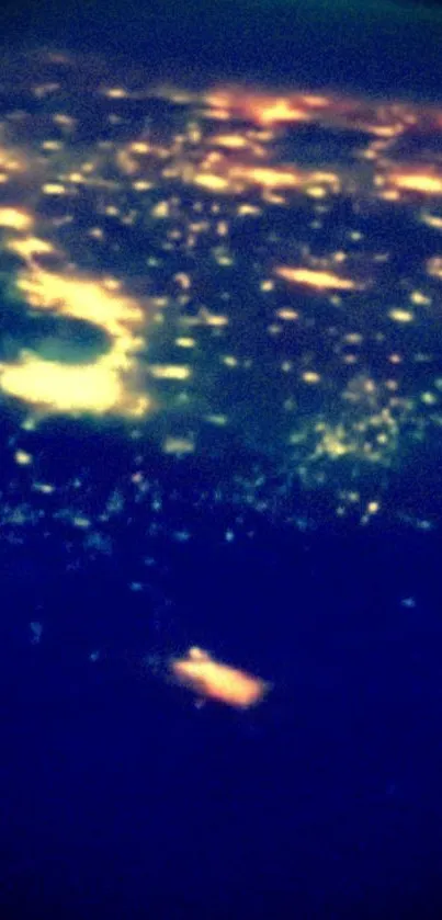 City lights viewed from space, glowing in dark.