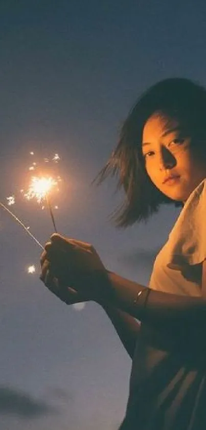 Nighttime silhouette holding sparkler under a starry sky on a mobile wallpaper.