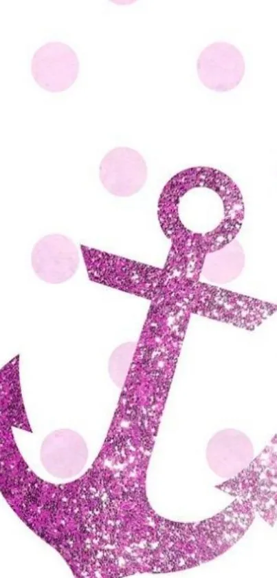 Pink glitter anchor on polka dot design background.