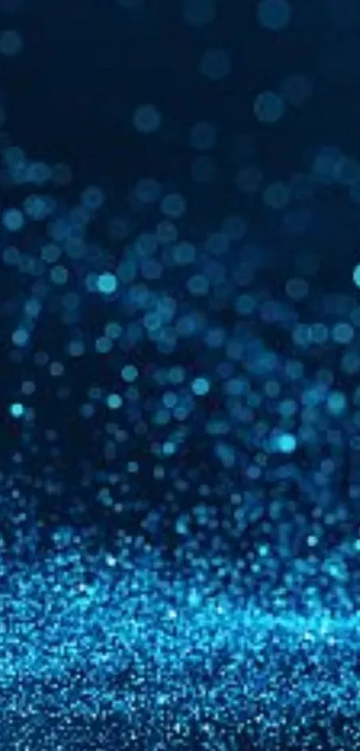 Sparkling blue bokeh wallpaper with abstract glow.