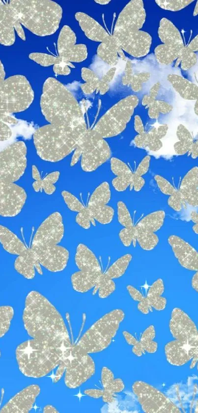 Shimmering butterflies against blue cloudy sky wallpaper.