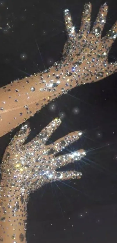 Hands adorned with sparkling crystal gloves on a black background.