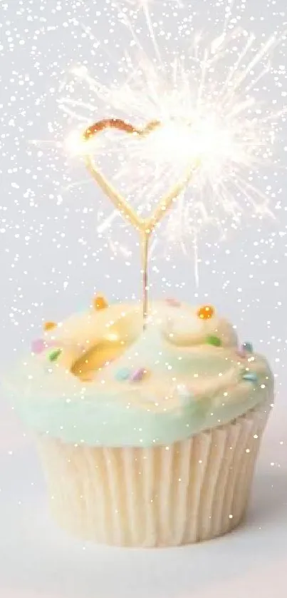 Cupcake with pastel frosting and heart-shaped sparkler.