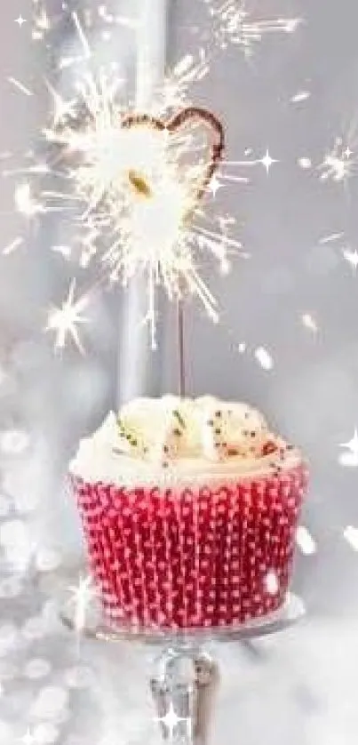 A sparkling cupcake with heart sparkler on a festive background.