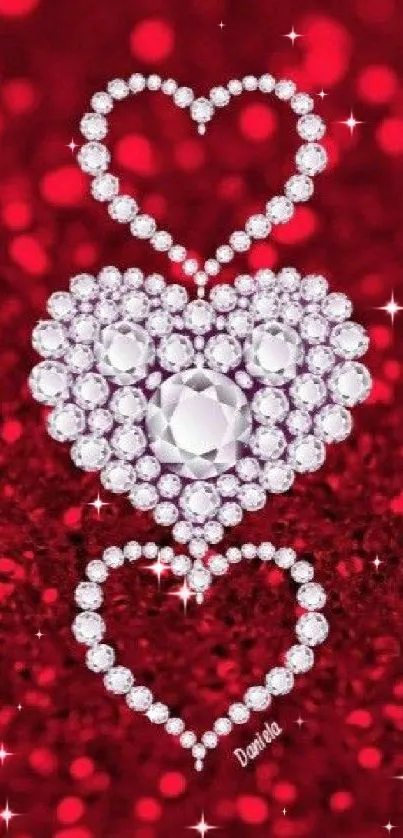 Three diamond hearts on a sparkling red background.